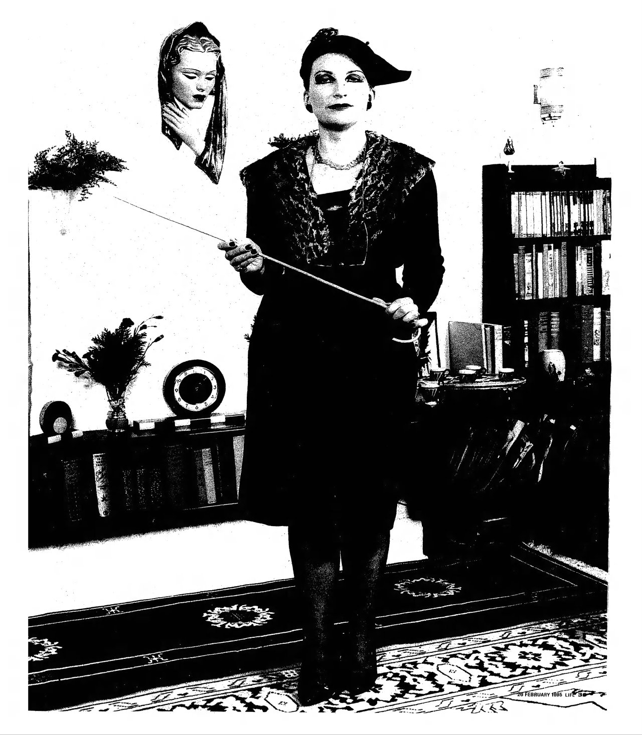 Miss Martindale stands in the Aristasian Embassy
